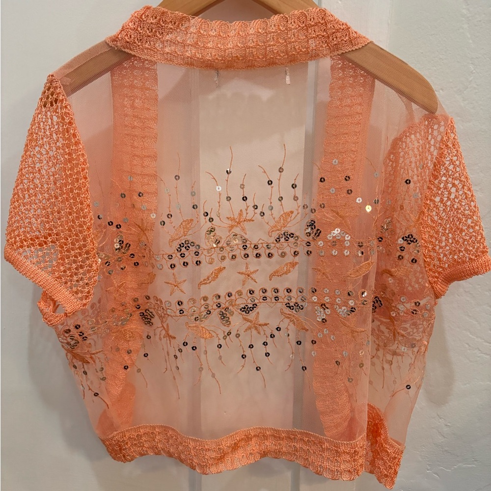 Womans light orange beaded top